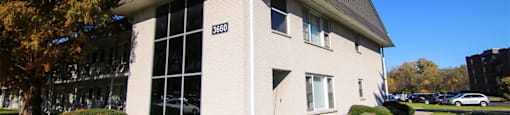 Building with a sidewalk in front of it at Lansing Riverwood, LLC, Lansing, IL, Illinois, 60438