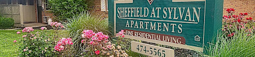 Property sign with flowers at Sheffield at Sylvan in Ohio