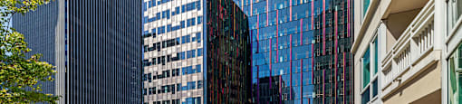 a patio with a view of skyscrapers and tables and chairs