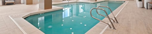 a swimming pool in the lobby of a hotel