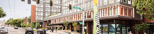 a large building on the corner of a busy city street