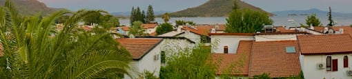 a group of houses with a view of the ocean