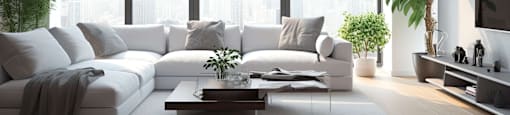 A modern living room with a white sofa set and a coffee table.