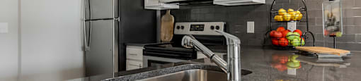 a kitchen with stainless steel appliances and a sink