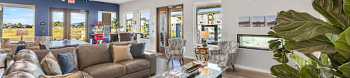 a living room with couches and chairs and a coffee table