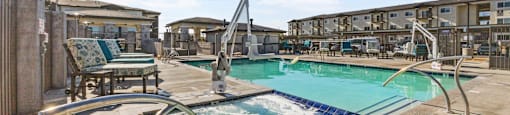 a resort style pool with chairs and chairs around it