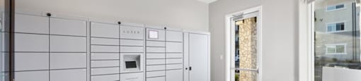a white room with a large white closet and a table