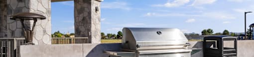 a stainless steel barbecue grill on a patio
