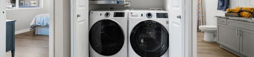 a laundry room with a washing machine and a dryer