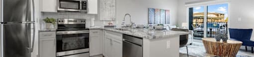 a kitchen with stainless steel appliances and a counter top