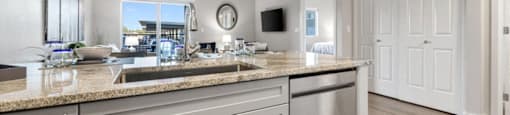 a kitchen with a counter top and a sink