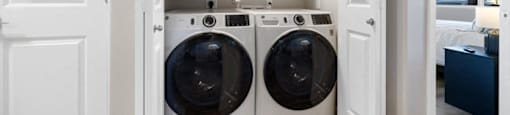 a laundry room with a washer and dryer in it