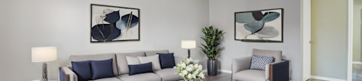 a living room with couches and a coffee table