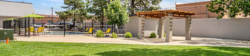a courtyard with a gazebo and a shade