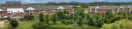 a view of a pond in front of a building
