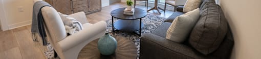 a living room with a couch and a table and a tv