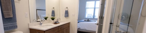 a bathroom with a toilet and a shower and a sink