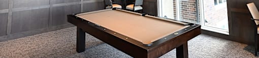 a conference room with a ping pong table and a tv