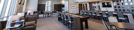 a large dining room with tables and chairs and a fireplace