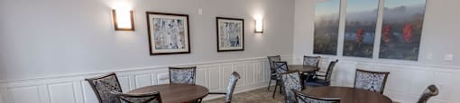 a dining room with tables and chairs