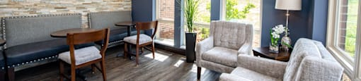 a living room with couches and chairs and a table