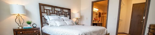 a bedroom with a bed and a closet