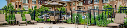 our apartments have a resort style pool with lounge chairs and umbrellas