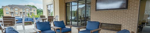 the private patio has a tv and chairs