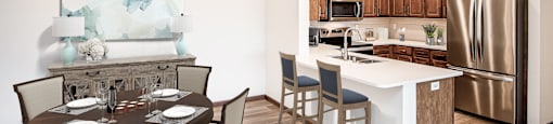 a kitchen and dining area in a 555 waverly unit