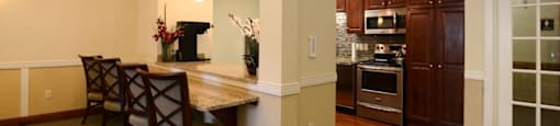 Community Room Kitchen and Breakfast Bar at Highlands at Riverwalk Apartments 55+, Mequon, WI,53092