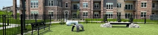 A large apartment complex with a playground in front.