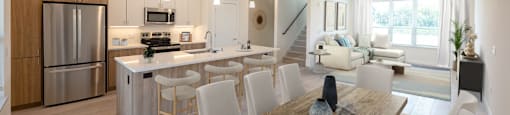 a kitchen and dining room with a table and chairs
