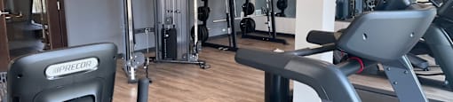 a gym with treadmills and other exercise equipment