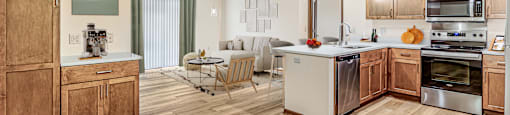 A kitchen with wooden cabinets and a white countertop.