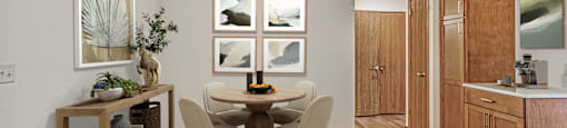 A dining room with a table set for four.