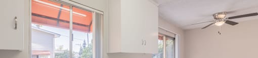 A kitchen with a sink and a window.