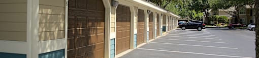 a row of garage doors on the side of a building