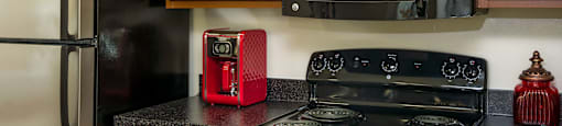 a kitchen with a stove microwave and refrigerator