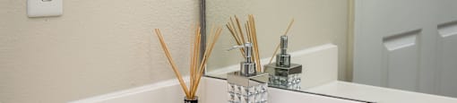 a bathroom sink with white counters