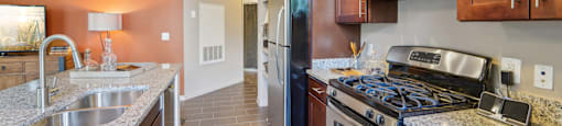 a kitchen with stainless steel appliances and granite counter tops
