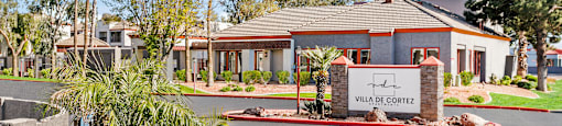a home with a sign that says villa court in front of it