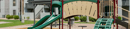 a playground at the whispering winds apartments in pearland, tx