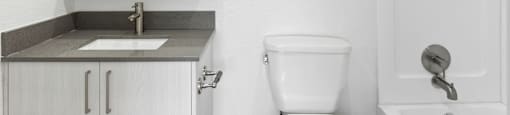 a bathroom with a toilet and a sink and a mirror