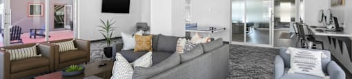 A modern living room with a grey sofa and a television.
