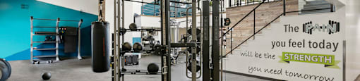 a gym with weights and a sign that says you feel today will be the strength