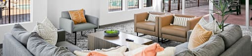 a living room with white walls and a large gray couch