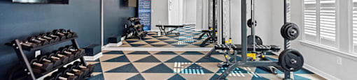 Fitness center weights at England Run Apartments in Fredericksburg VA
