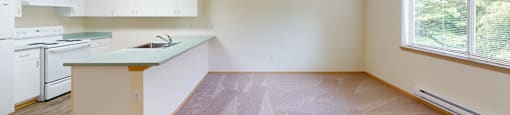 Kitchen with living room space at Alderwood Court in Lynnwood WA