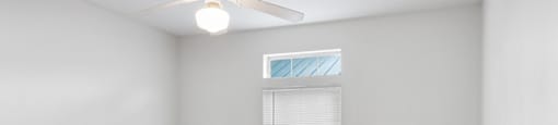 Bedroom with ceiling fan at Tidwell Estates in Houston TX