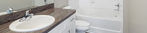 Bathroom sink at Falls Pointe at the Park Apartments in Durham NC